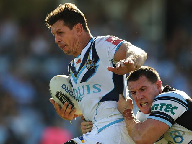 Greg Bird is tackled by Cronulla's Paul Gallen. Pic Brett Costello