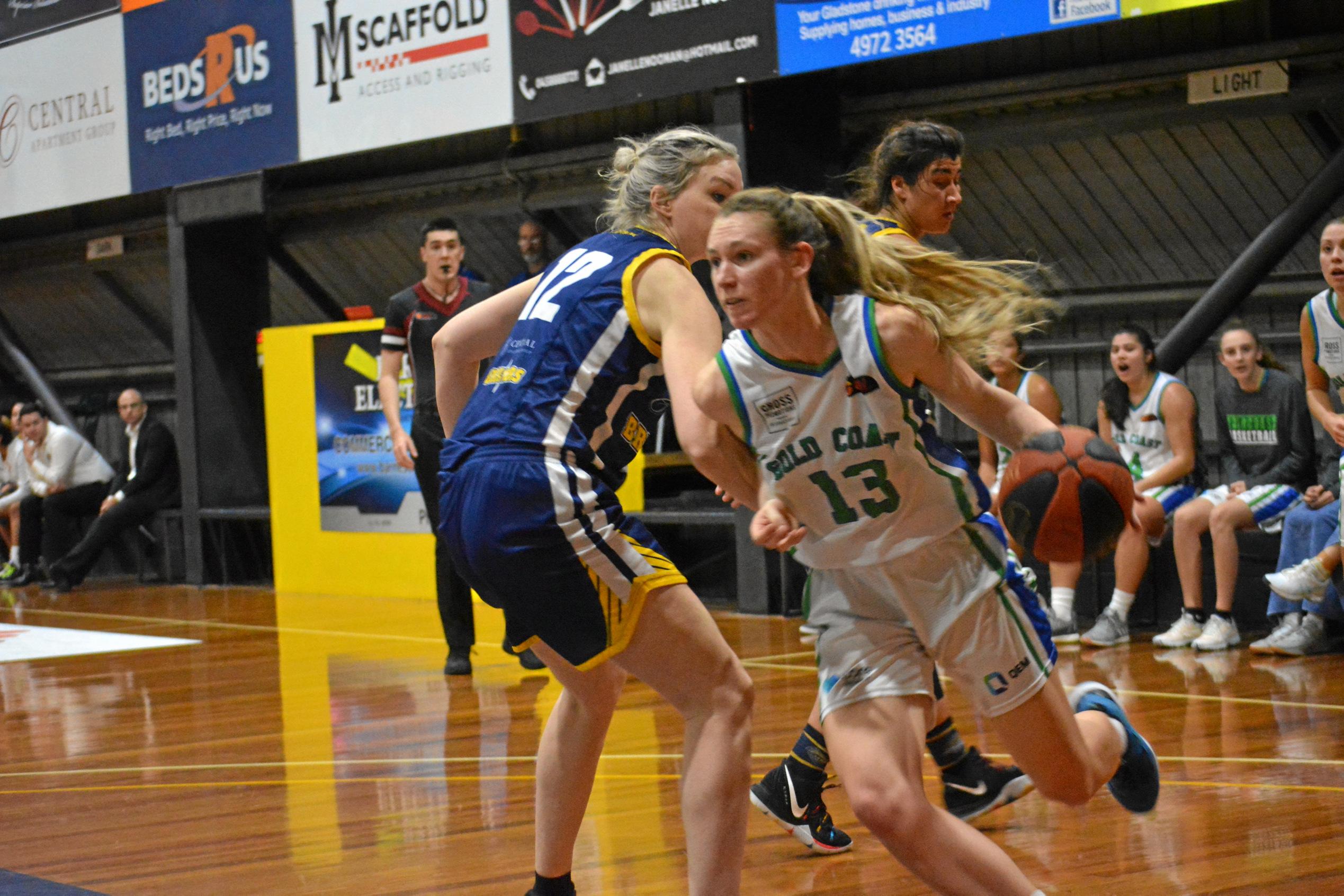 Carleigh Patrick gets past Amanda Beatson. Picture: Nick Kossatch GLA040819QBL