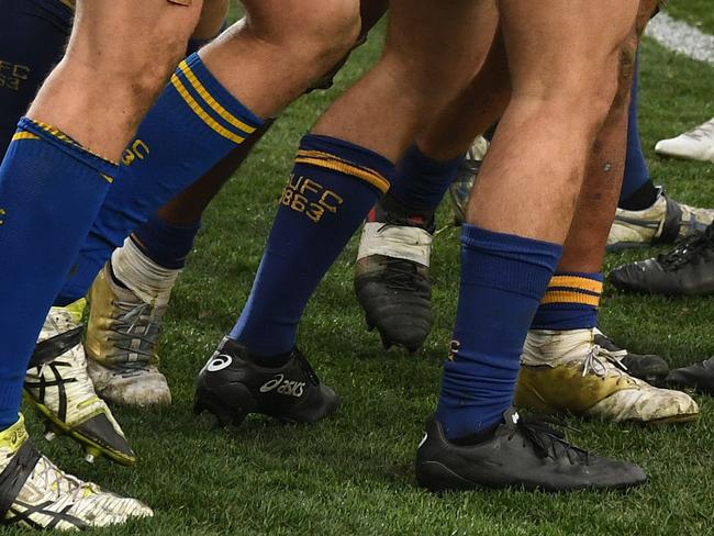 Tolu Latu (centre) of Sydney University celebrates with teammates after scoring a try during the 2018 Intrust Super Shute Shield Rugby Grand Final match between Sydney University and Warringah at North Sydney Oval in Sydney, Saturday, September 1, 2018. (AAP Image/Joel Carrett) NO ARCHIVING, EDITORIAL USE ONLY