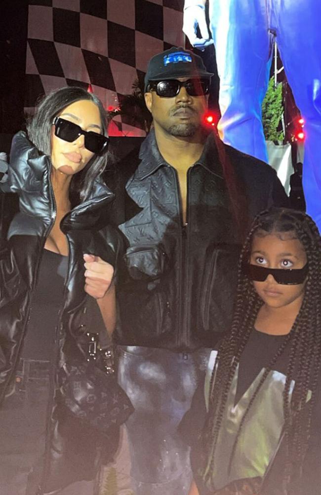 Kim, Kanye and North were matching in black shades at the show. Picture: Instagram.
