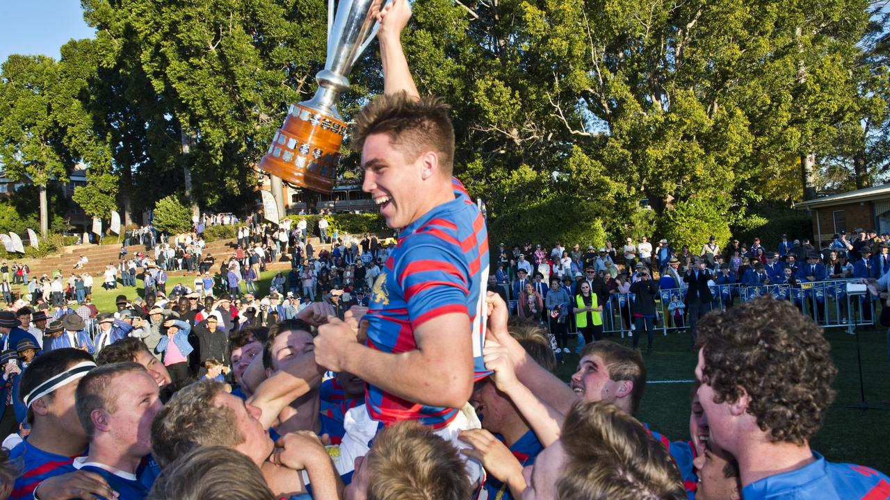 Downlands captain Mac Grealy and his teammates celebrate winning the 2019 O’Callaghan Cup.