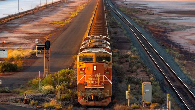 A BHP freight train carrying Australian iron ore to port. Australia ships around a third of its overall exports to China. Picture: Ian Waldie/Bloomberg