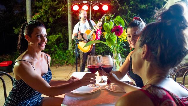 Scott Murphy performs for birthday girl Kristy Love and friends Sarah Makin and Christi Hamon. Picture: Che Chorley