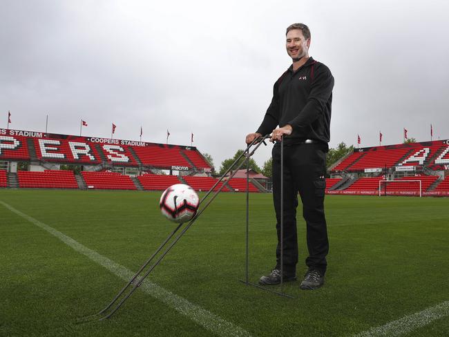 Groundsman Simon Sczesny tests the ball speed of the Hindmarsh Stadium pitch. Picture Sarah Reed