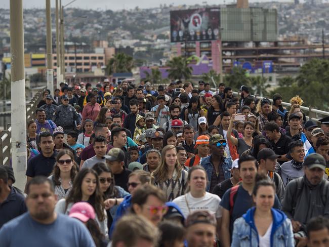 Hundreds of immigrants, the remnants of a caravan of Central Americans that journeyed across Mexico to ask for asylum in the United States, have reached the border to apply for legal entry. Picture: David McNew/Getty Images