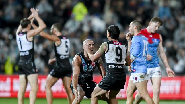 ADELAIDE, AUSTRALIA - MAY 19: Sam Powell-Pepper of Port Adelaide and Zak Butters  celebrate the final siren during the round 10 AFL match between Yartapuulti/Port Adelaide Power and Narrm Football Club/Melbourne Demons at Adelaide Oval, on May 19, 2023, in Adelaide, Australia. (Photo by Mark Brake/Getty Images)