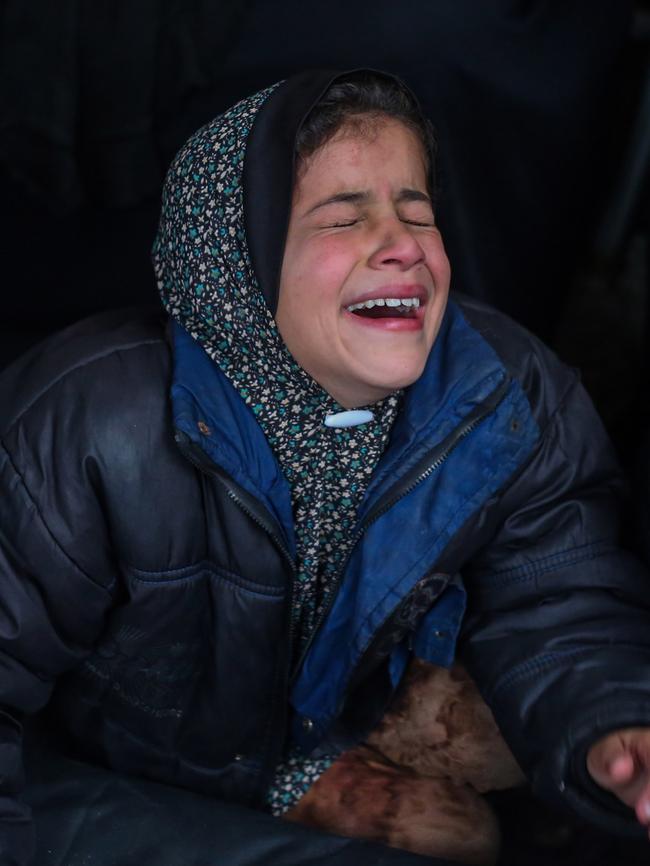 A girl mourns as the dead bodies of victims of an Israeli strike in Rafah, Gaza, are received. Picture: Getty Images