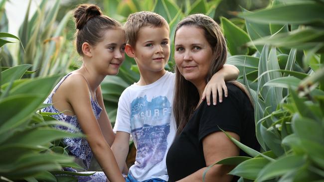 Jacqui Simpson with children Connor and Jade at home in Brisbane yesterday. ‘I felt like a bird in a cage’. Picture: Lyndon Mechielsen