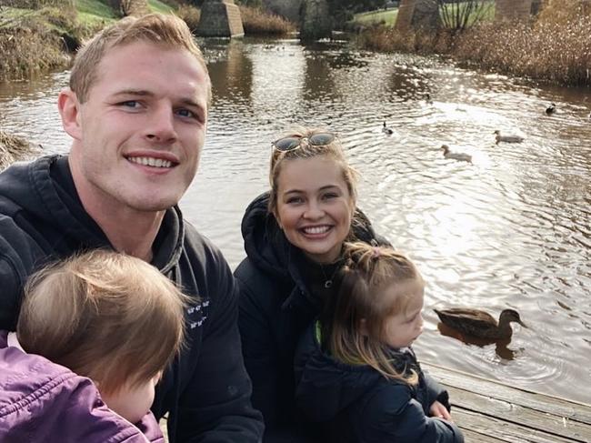 Tom Burgess and Tahlia Giumelli with their children.