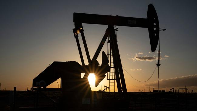 (FILES) Pump jacks operate near Loco Hills on April 23, 2020 in Eddy County, New Mexico, part of the Permian Basin. ExxonMobil sealed a megadeal to acquire Pioneer Natural Resources for about $60 billion, bolstering its holdings in the Permian Basin, a key US petroleum region, the companies announced on October 11, 2023. Under the all-stock transaction, ExxonMobil will buy Texas-based Pioneer for $59.5 billion based on ExxonMobil's closing price on October 5. The overall transaction, including debt, is valued at around $64.5 billion, the companies said. (Photo by Paul Ratje / AFP)