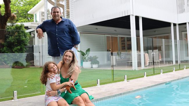 Kieren Maddern and Matthew Williams, with their daughter Vesper, 8, are selling their home in Brisbane’s Clayfield, which has been named by Realestate.com.au as one of the nation’s Hot 100 suburbs for 2025. Picture: Mackenzie Scott