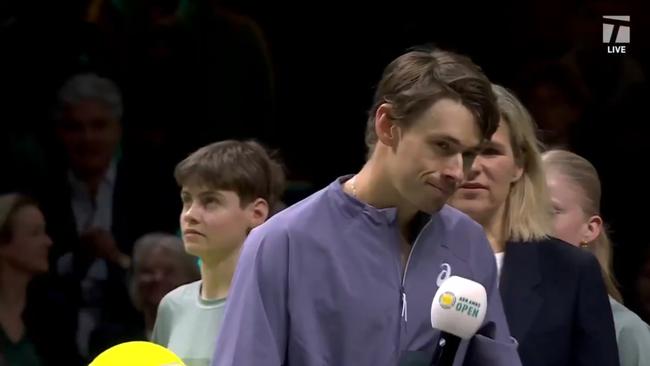 Alex de Minaur grimaces in the middle of his speech. Photo: X and Tennis Channel.