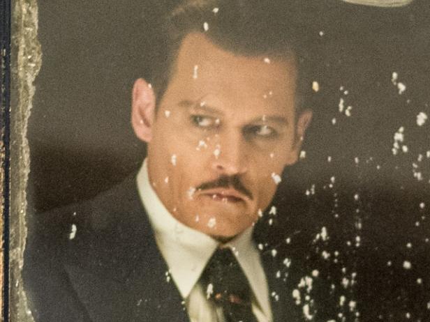 Johnny Depp as Ratchett in a scene from Twentieth Century Fox's film Murder on the Orient Express.