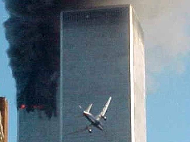 SEPTEMBER 11, 2001 : Video still of hijacked commercial aircraft about to fly into second tower of World Trade Centre in New York, 11/09/01 soon after another aircraft had flown into other tower where smoke still billows. Pic from TV.