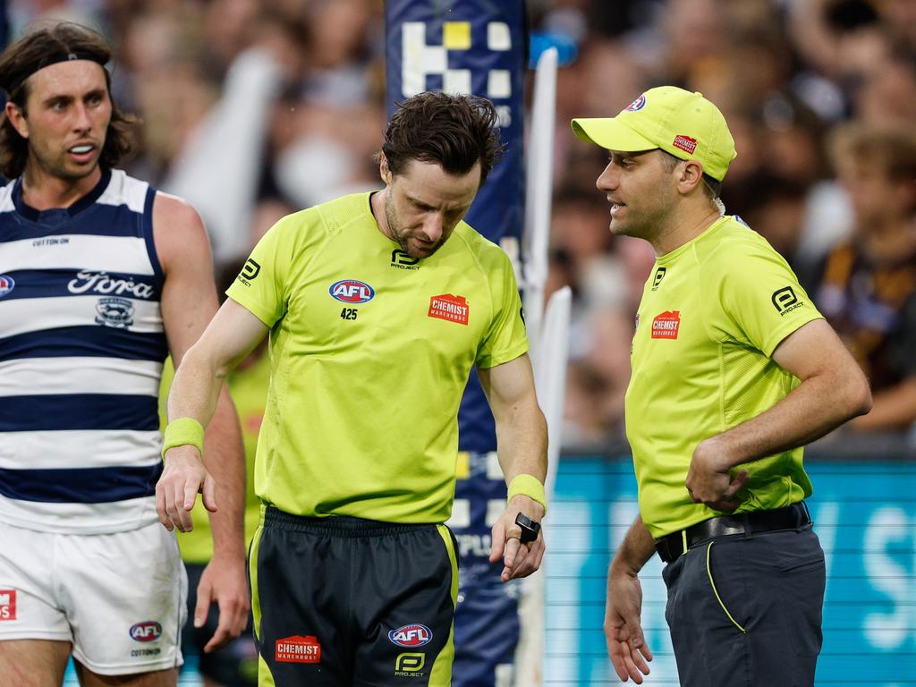 MELBOURNE, AUSTRALIA - APRIL 01: AFL Field Umpire, Brendan Hosking and AFL Goal Umpire, Steven Piperno request a score review during the 2024 AFL Round 03 match between the Hawthorn Hawks and the Geelong Cats at the Melbourne Cricket Ground on April 01, 2024 in Melbourne, Australia. (Photo by Dylan Burns/AFL Photos via Getty Images)