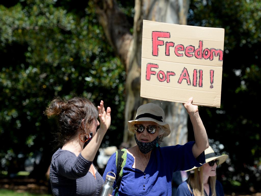 Supporters wave to a group of refugees from the Park Hotel in Carlton. Picture: Andrew Henshaw