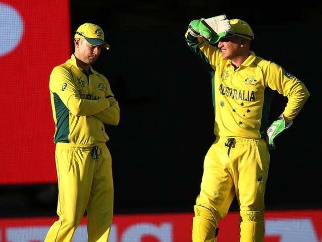 Australia captain Michael Clarke and Brad Haddin assess the situation. Picture: Phil Hillyard.
