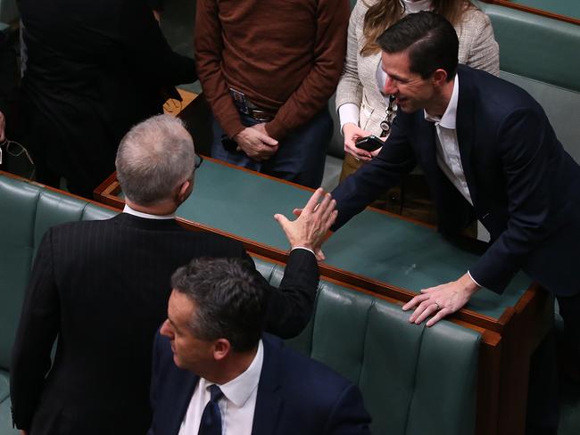 PM Malcolm Turnbull shakes hands with the Education Minister Simon Birmingham after the vote on the Education Bill passed in the House of Representatives. Picture Kym Smith