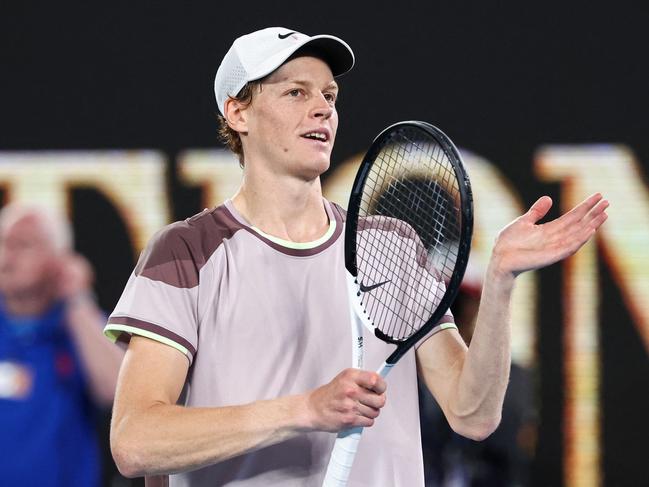 Italy's Jannik Sinner celebrates after victory against Russia's Andrey Rublev during their men's singles quarter-final match on day 10 of the Australian Open tennis tournament in Melbourne on January 24, 2024. (Photo by David GRAY / AFP) / -- IMAGE RESTRICTED TO EDITORIAL USE - STRICTLY NO COMMERCIAL USE --