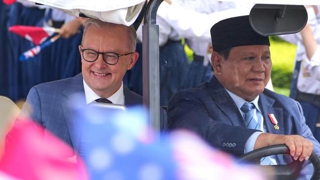 Albanese and Indonesian President Prabowo Subianto ride a golf cart at Merdeka Palace in Jakarta, Indonesia. Picture: Dita Alangkara/AP