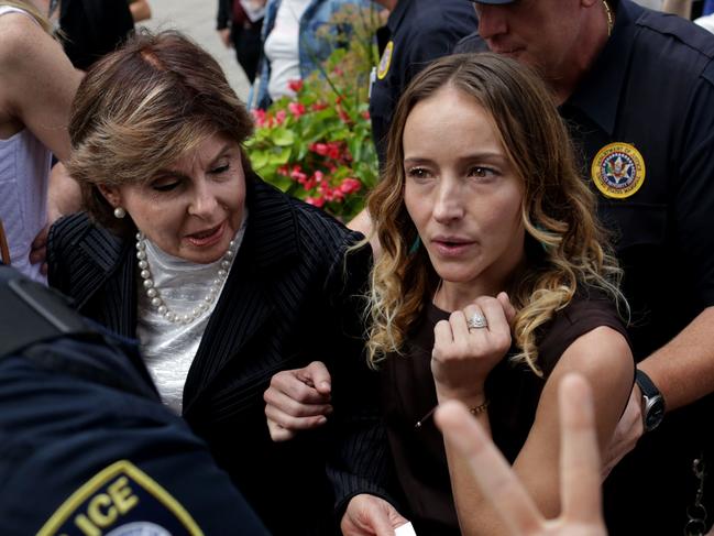 Teala Davies, right, one of Jeffrey Epstein's alleged victims and attorney Gloria Allred, finish speaking to the press outside the US Federal Court. Picture: AFP