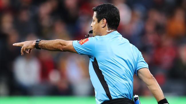 Referee Alireza Faghani points to the penalty spot after reviewing a VAR-backed handball was ruled in the A-League match between Western Sydney and Central Coast. Picture: Getty