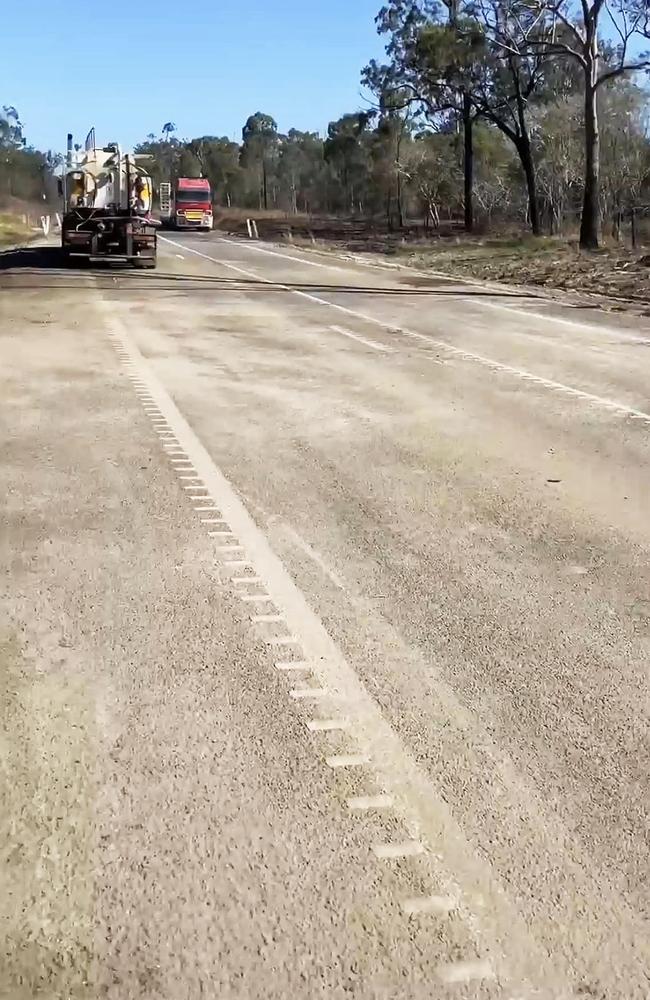 Repair crews at the explosion site on the Bruce Highway