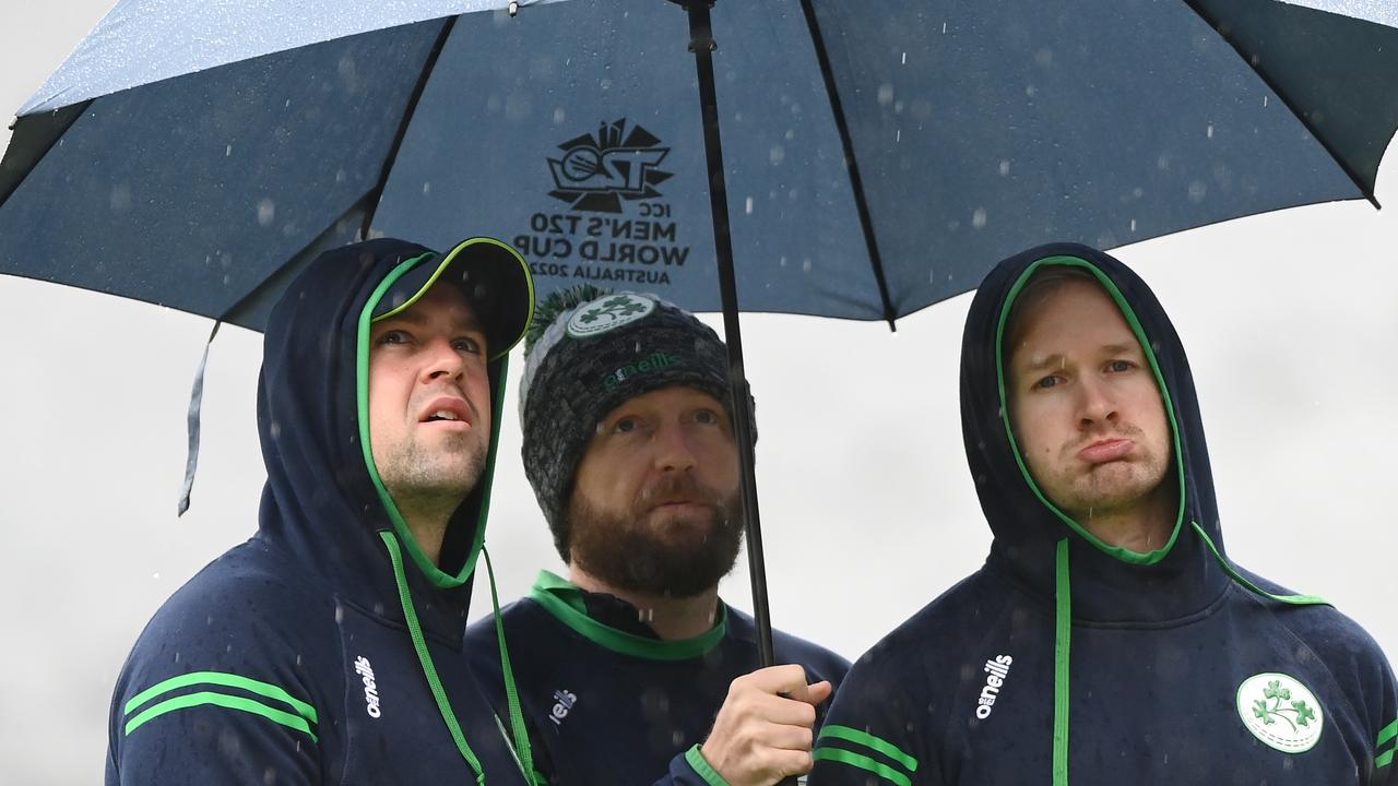 Irish cricketers watch the rain fall at the MCG. Photo by Quinn Rooney/Getty Images