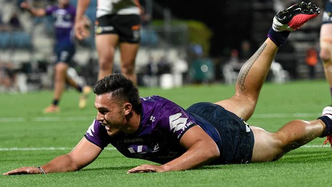 Tino Faasuamaleaui of the Storm scores a try during the round 19 NRL match between the Melbourne Storm and the Wests Tigers at Sunshine Coast Stadium.