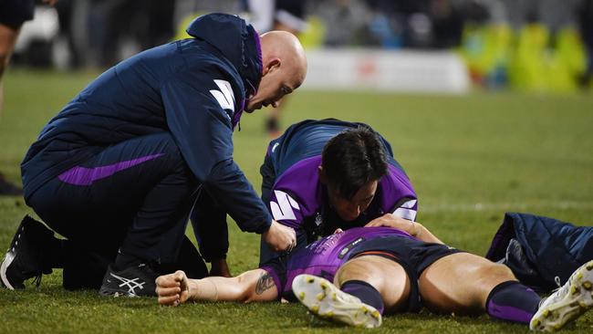 Billy Slater of the Storm is attended to by medical staff after being knocked out by Iosia Soliola of the Raiders during the Round 20 NRL match between the Canberra Raiders and the Melbourne Storm at GIO Stadium in Canberra, Saturday, July 22, 2017. (AAP Image/Mick Tsikas) NO ARCHIVING, EDITORIAL USE ONLY