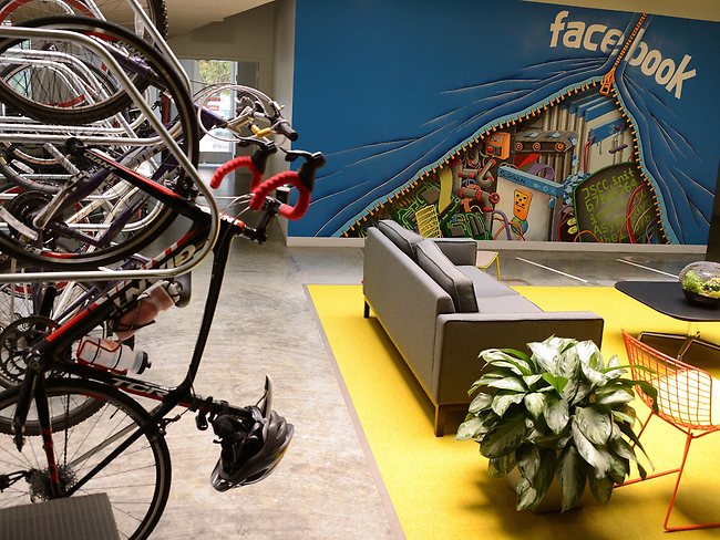 <p>Bicycles hang on the wall in one of the many open work spaces at the Facebook headquarters in Menlo Park, California</p> <p>Picture: AFP</p>