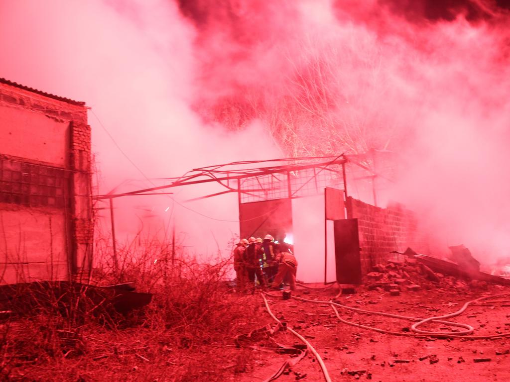 Firefighters work to put out a fire at a fireworks storage facility in Kharkiv after it was struck by a Russian missile in a residential neighbourhood. Picture: Spencer Platt/Getty Images