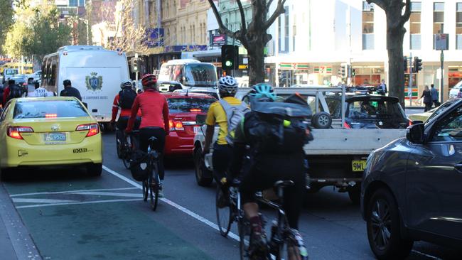 A taxi blocks the former bike lane on Exhibition St.