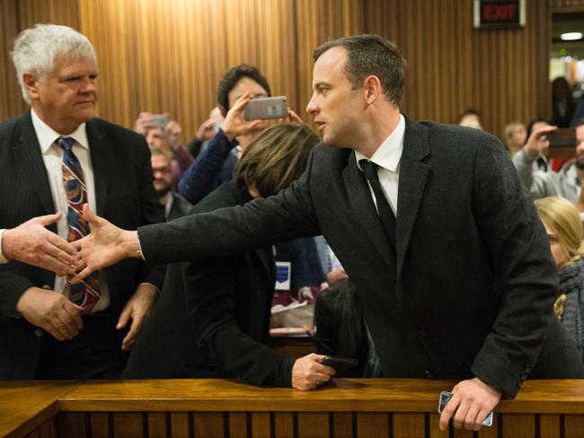 Oscar Pistorius shakes a supporter’s hand.