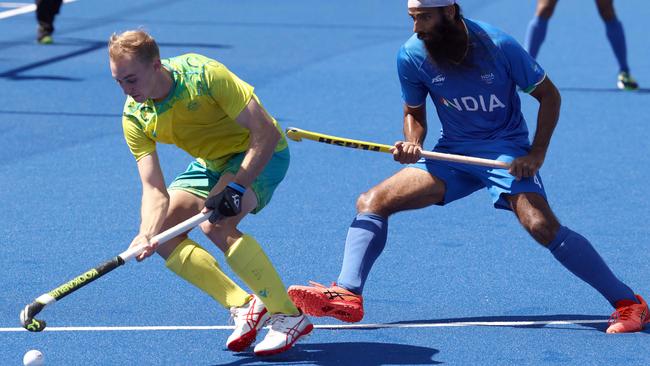 Australia's Jacob Anderson (L) vies with India's Singh Jarmanpreet during the men's gold medal hockey match between Australia and India on day eleven of the Commonwealth Games at the University of Birmingham Hockey and Squash Centre in Birmingham, central England, on August 8, 2022. (Photo by DARREN STAPLES / AFP)