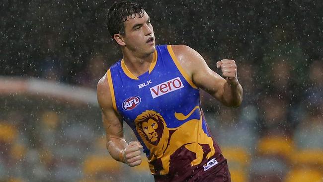 Lion Tom Rockliff celebrates kicking a goal in the demolition of Gold Coast. Picture: Getty