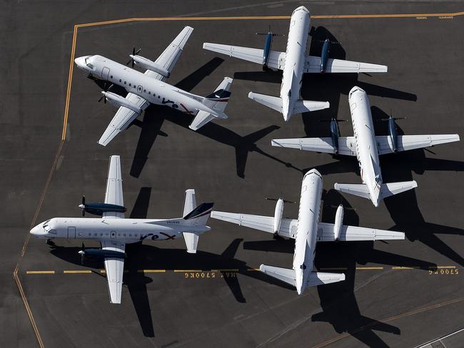 SYDNEY, AUSTRALIA - APRIL 22: An aerial view of Rex Airlines aircraft at Sydney Airport on April 22, 2020 in Sydney, Australia. Restrictions have been placed on all non-essential business and strict social distancing rules are in place across Australia in response to the COVID-19 pandemic.  (Photo by Ryan Pierse/Getty Images)