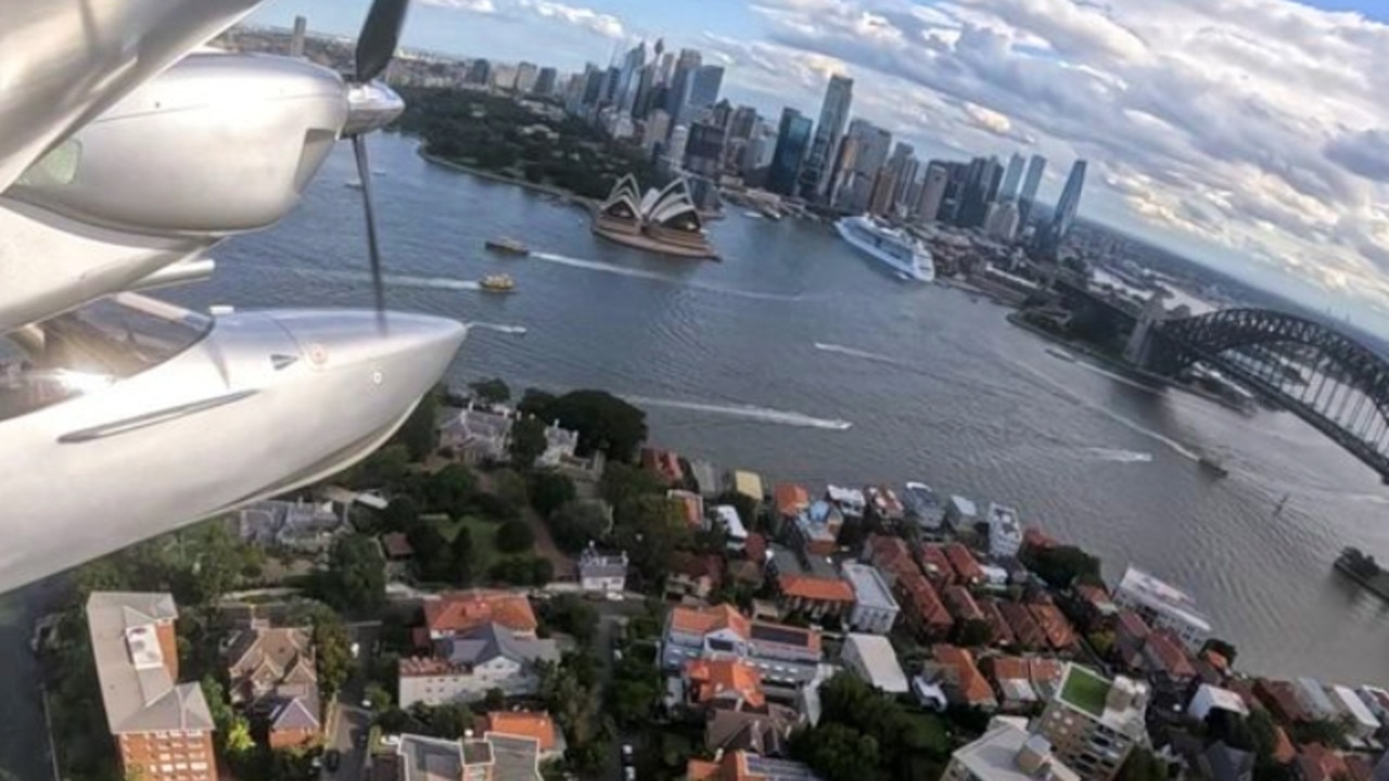 Michael Smith flies over the Sydney Harbour in his twin engine Chaika LLC L65 Seabear Southern Sun. Picture: Supplied/ Instagram/ Southern Sun.