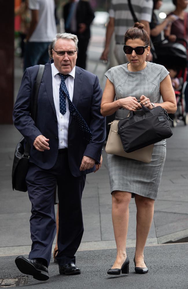 Michael Cranston with an unidentified woman, walking into the Downing Centre court complex in central Sydney on Thursday morning. Picture: Monique Harmer