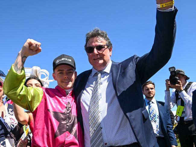 MELBOURNE, AUSTRALIA - NOVEMBER 05: Robbie Dolan poses with trainer John Symons after  Knight's Choice won Race 7, the Lexus Melbourne Cup - Betting Odds during Melbourne Cup Day at Flemington Racecourse on November 05, 2024 in Melbourne, Australia. (Photo by Vince Caligiuri/Getty Images)