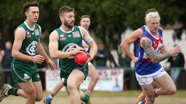 NFL: Zac McCubbin on the run for Greensborough. Picture: Hamish Blair