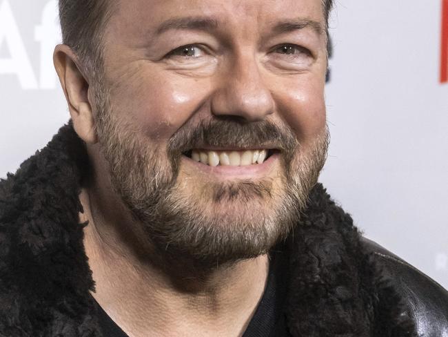 FILE - In this Thursday, March 7, 2019, file photo, Ricky Gervais attends a screening of Netflix's "After Life" at the Paley Center for Media in New York. Gervais is returning to host the Golden Globe Awards. Gervais is returning to host the Golden Globe Awards, which will be held at the Beverly Hilton Hotel on Jan. 5, 2020 and aired live on NBC. (Photo by Charles Sykes/Invision/AP, File)