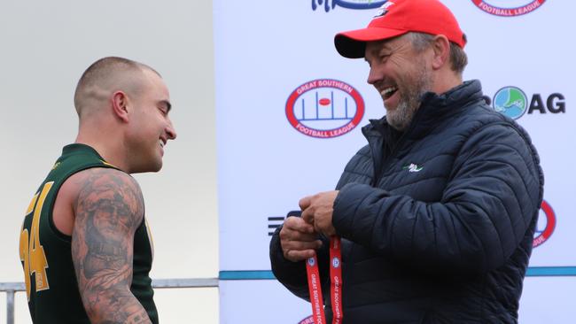 Kennedy is presented with his best on ground medal during this year's GSFL grand final by Tony Modra. Picture: Dos Photography