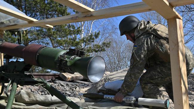 A Ukrainian soldier prepares a rocket launcher on the front line, near Kyiv. Picture: AFP