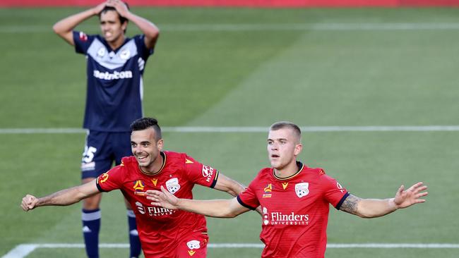 Riley McGree, lower right, scores the opening goal with Nikola Mileusnic about to come in and celebrate with him. Victory’s Brandon Lauton in the background has his hands on his head. Picture: Sarah Reed