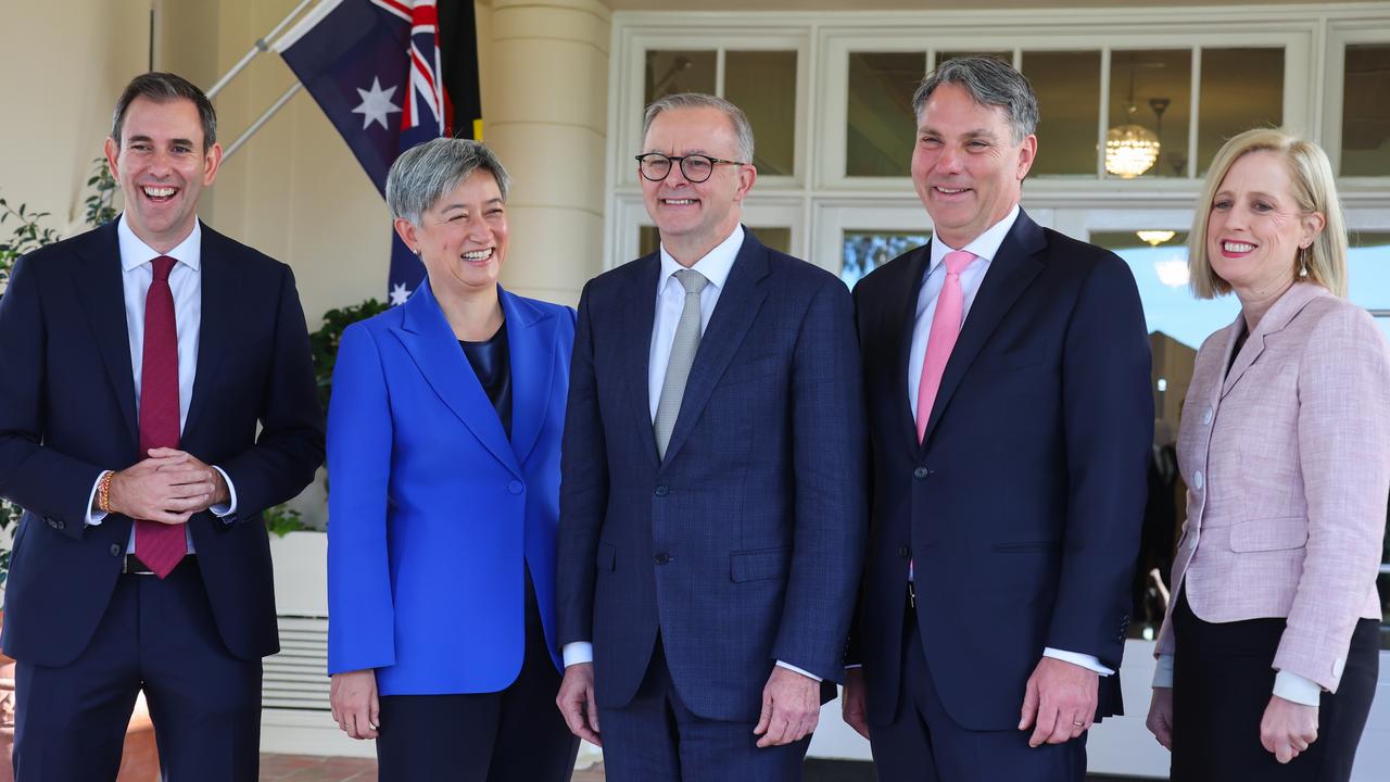 (Left to Right) Jim Chalmers, Penny Wong, Anthony Albanese, Richard Marles and Katy Gallagher pose for a photograph outside Government House after being sworn. Picture: Getty Images