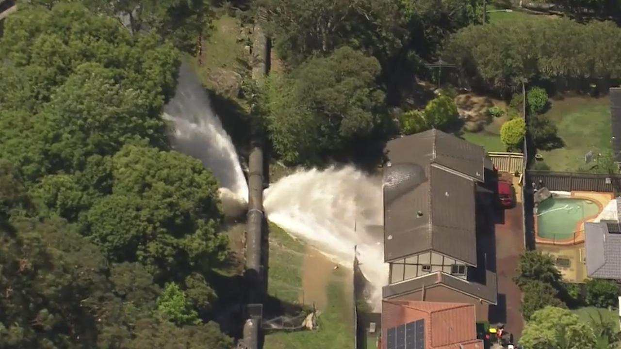 The pipeline in Como, Sydney, burst on Friday afternoon and sent torrents of water pouring into nearby homes. Picture: Supplied / 9 News