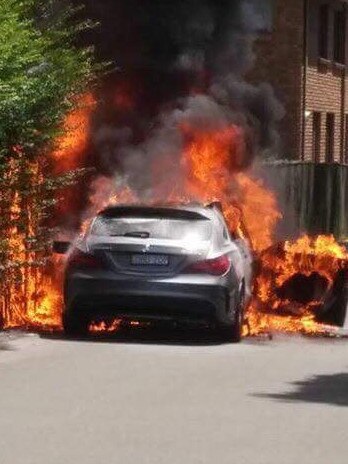 The gunmen getaway car was set alight in Chandler St. Picture: Claude Nunes