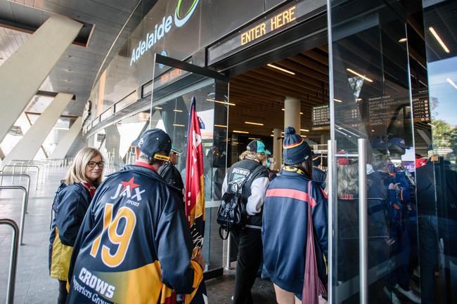 Crows and Port Adelaide fans walking into Adelaide Oval to be extras in film 