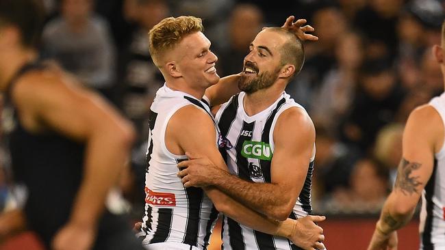 Adam Treloar and Steele Sidebottom helped Collingwood notched its first win of the season. Picture: AAP